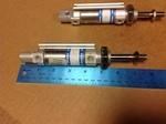 Festo DSNN-25-25 P-a Specie: E708 Air Cylinder, Nos, Lot Of Two. Fixed Price $50.00.