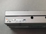 Smc MXF12-50 Low Prifile Slide Table 12MM Diameter Bore. Fixed Price $120.00.
